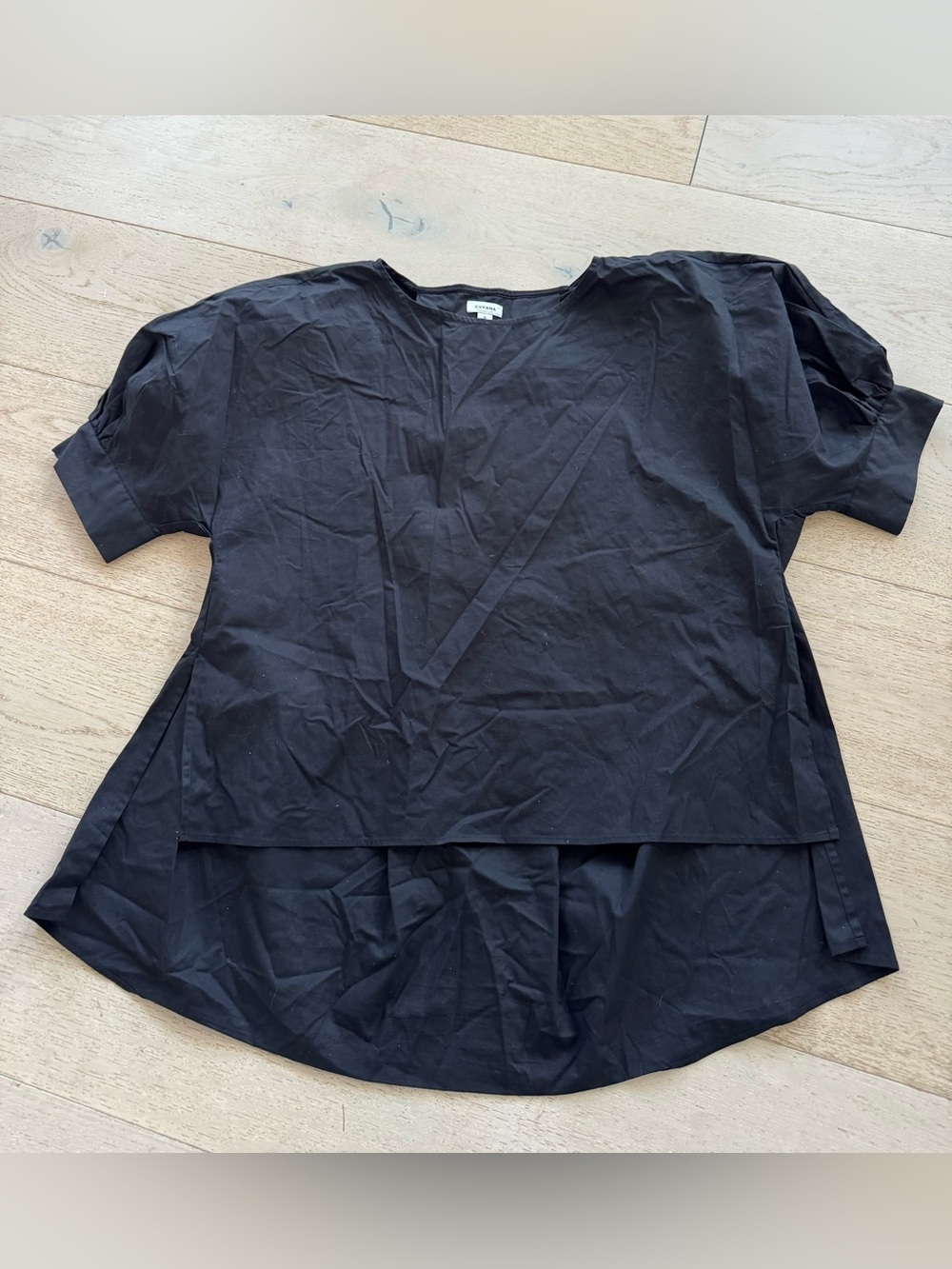 Cuyana black short sleeve hi low blouse S